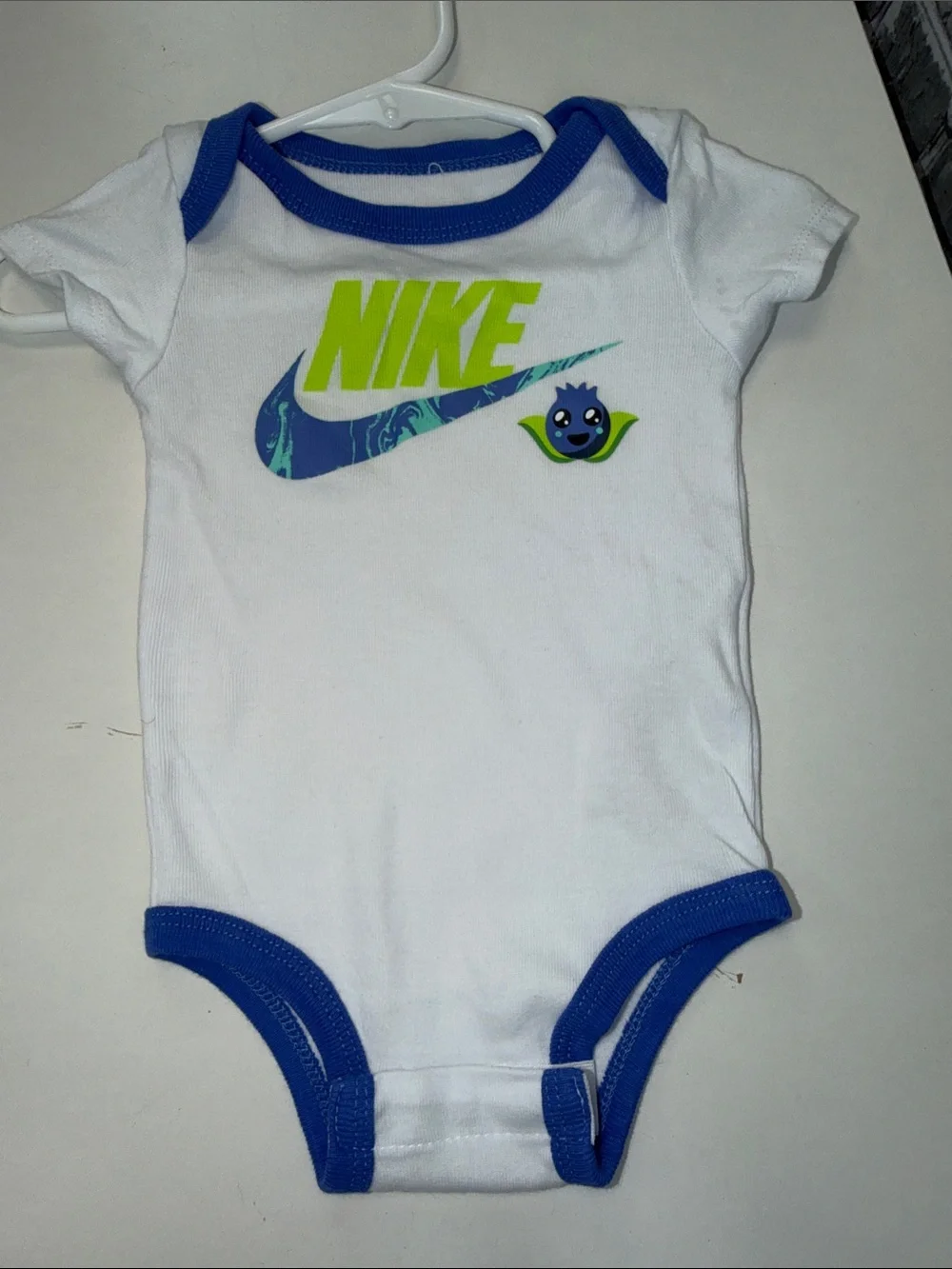 Baby Nike White One-Piece Bodysuit with Blue Trim & Neon Green Logo‎